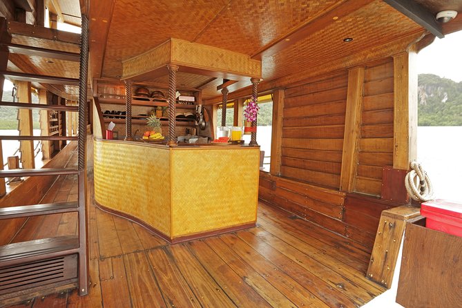 - Comfortable boat for cruising in Phang Nga Bay - The "Must-Do"! - Stop 1: Phang Nga Bay—cliffs, caves, and local bird-nest collectors