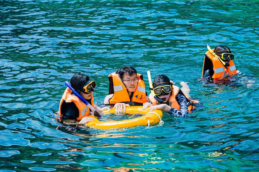 From Phuket: Coral Island Kahung Beach Speedboat Trip - Arrival at Kahung Beach: a set beach spot beats the scramble