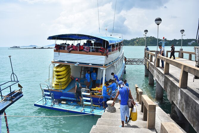 James Bond Island Tour with Sea Cave Kayaking & Glowing Plankton - Phang Nga Bay photo time and James Bond Island from the water