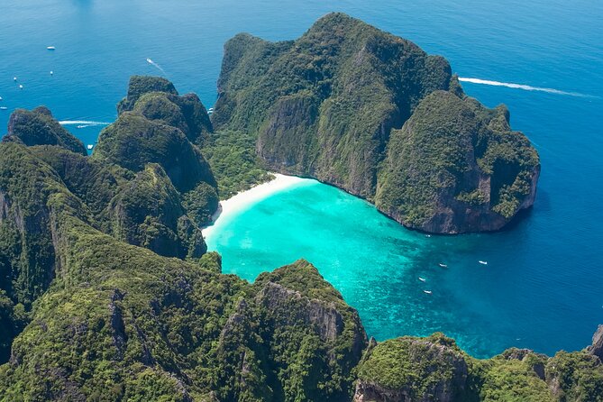 Phi Phi & Bamboo Island Full Day Tour by Premium Speed-Catamaran - Stop 2: Pileh Lagoon swimming and jumping in turquoise water