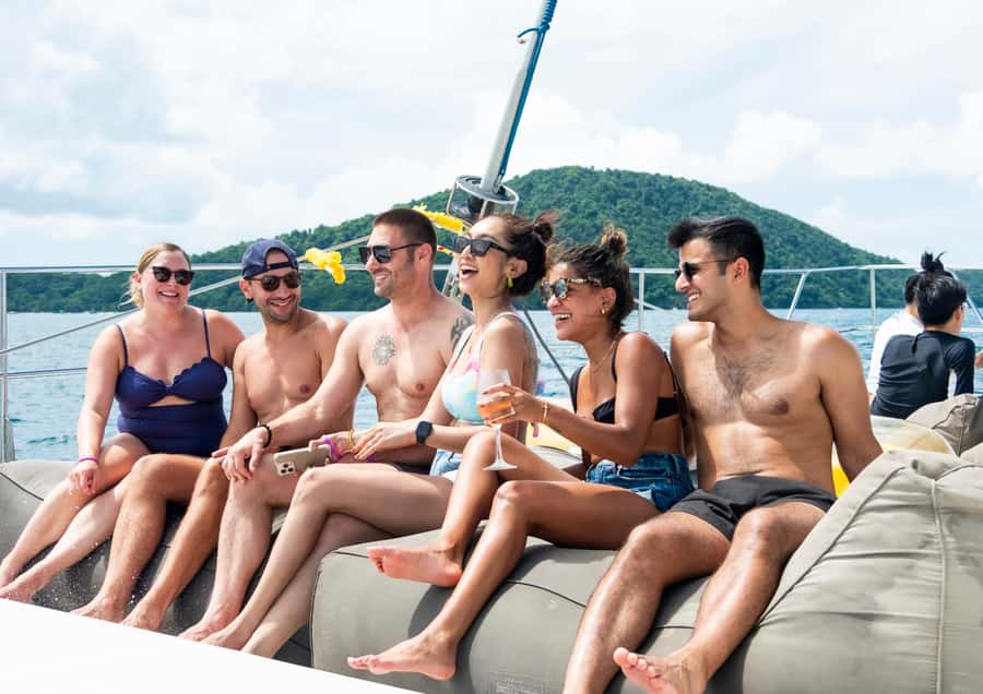 Phuket: Coral, Racha, Promthep Island Party Catamaran trip - Pickup, boarding, and the rhythm of the day