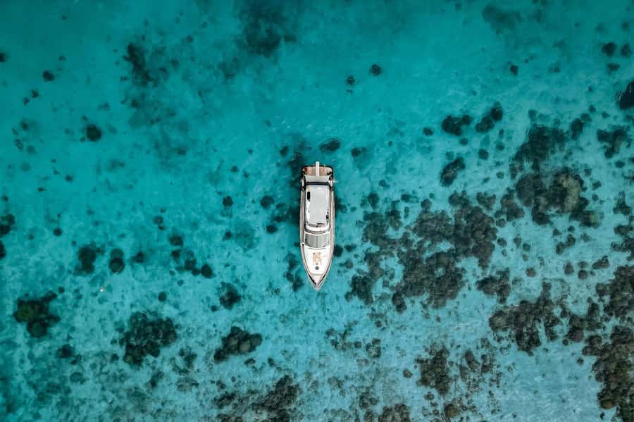 Phuket: Phi Phi Island & Maya Bay Luxury Yacht Day Tour - The yacht vibe: DJ music, lounging, and your included welcome drink