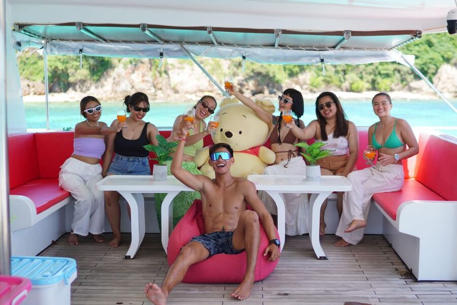 Phuket: Racha and Coral Island Sailing Day Trip by Miss.Red - The fun stuff: water toys, slides, and transparent kayaking vibes