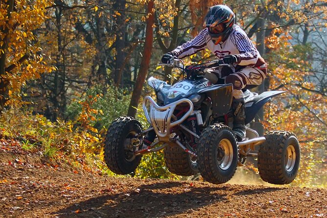 Phuket Rafting ATVing Flying Fox Full Day Activities By VIP Mini Van - ATV through farms and palm gardens: your hour of dirt-road views