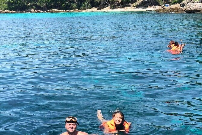 Phuket Raya Island Day Tour with Snorkeling OR Scuba Diving - Coral Island (14:30–15:30): swimming, sunbathing, and a chair for THB 100