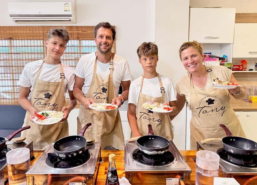 Phuket: Thai Cooking Class with 4 Dishes and Market Visit - The cooking school setup: open kitchen, welcome drink, your own station