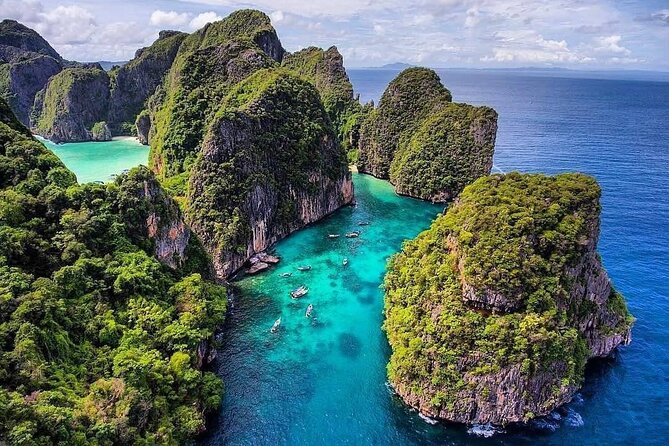 Private Phi Phi and Khai Islands Snorkeling Tour by Speedboat - Pileh Bay: swimming and paddle-boarding in the limestone ring