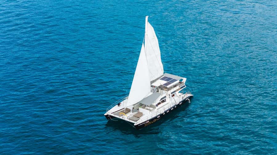 SUNWIND Phuket: Coral and Racha Islands Catamaran Tour - The SUNWIND catamaran experience: slide, DJ, and space that matters